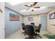 Well-lit office featuring a central meeting table, neutral-toned walls, and an American flag decoration at 2928 Feather Dr, Clearwater, FL 33759