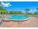 Community pool featuring a clean design, and comfortable lounge seating at 2928 Feather Dr, Clearwater, FL 33759
