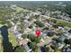 Aerial view of a neighborhood with mature trees and access to water, marked by a red pin at 3202 Cullendale Dr, Tampa, FL 33618