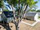 Aerial shot featuring home with a dark roof, lush trees, and an expansive driveway at 3202 Cullendale Dr, Tampa, FL 33618