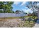 Large, grassy backyard enclosed by a white privacy fence, offering a secure outdoor space at 3202 Cullendale Dr, Tampa, FL 33618