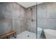 Modern shower with glass surround featuring stone look wall tiles and a built-in bench at 3202 Cullendale Dr, Tampa, FL 33618