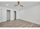 Bright bedroom with hardwood floors, ceiling fan, and closet space provides comfortable living at 3202 Cullendale Dr, Tampa, FL 33618