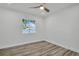 Bright bedroom with wood floors, modern fan, and plenty of natural light at 3202 Cullendale Dr, Tampa, FL 33618