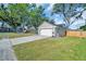 Beautiful garage with a well-manicured lawn and long driveway provides ample parking at 3202 Cullendale Dr, Tampa, FL 33618