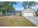 Charming single-story home featuring a well-manicured lawn, attached two-car garage, and tasteful landscaping at 3202 Cullendale Dr, Tampa, FL 33618