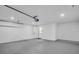 Clean garage interior featuring painted walls, concrete floor, and access door at 3202 Cullendale Dr, Tampa, FL 33618