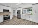 Beautiful updated kitchen features stainless steel appliances, custom cabinets, and modern fixtures at 3202 Cullendale Dr, Tampa, FL 33618
