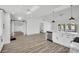 Open living space featuring modern finishes, luxury vinyl floors, and an open-concept kitchen at 3202 Cullendale Dr, Tampa, FL 33618