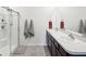 Bright bathroom featuring dual sinks, and a walk-in shower at 33716 Elm Hill Br, Wesley Chapel, FL 33545
