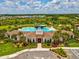 The Westgate Avalon Park clubhouse features a pool, landscaping, and community homes at 33716 Elm Hill Br, Wesley Chapel, FL 33545