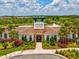 The Westgate Avalon Park clubhouse is surrounded by palm trees and landscaping at 33716 Elm Hill Br, Wesley Chapel, FL 33545