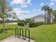 Landscaped community space featuring a bike rack, recreation center, and pool at 33716 Elm Hill Br, Wesley Chapel, FL 33545