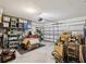 Spacious two car garage featuring ample room for storage and access to home at 33716 Elm Hill Br, Wesley Chapel, FL 33545