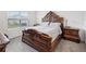 Spacious bedroom features a large window for natural light and carpeted floors at 33716 Elm Hill Br, Wesley Chapel, FL 33545