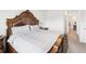 Comfortable bedroom featuring carpet flooring, large bed frame, and natural light at 33716 Elm Hill Br, Wesley Chapel, FL 33545