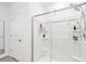 This shower has a glass enclosure, shelves, and dual shower heads at 33716 Elm Hill Br, Wesley Chapel, FL 33545