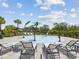 Community splash pad with playful water features and lounge chairs at 33716 Elm Hill Br, Wesley Chapel, FL 33545