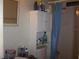 Bathroom featuring toilet, vanity, mirror, shower with a blue curtain, and cabinets at 33821 Terrace Blvd, Wesley Chapel, FL 33543