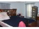Comfortable bedroom with natural light and a decorative headboard at 33821 Terrace Blvd, Wesley Chapel, FL 33543