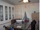 Cozy dining area featuring built-in cabinets and a glass-top table at 33821 Terrace Blvd, Wesley Chapel, FL 33543
