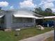 Cozy single-story home with awnings, adorned with charming lawn ornaments at 33821 Terrace Blvd, Wesley Chapel, FL 33543