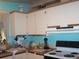 Compact kitchen features essential appliances and ample storage cabinets at 33821 Terrace Blvd, Wesley Chapel, FL 33543