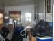 Living room featuring a couch, table, windows with curtains, and boxes and household belongings piled around at 33821 Terrace Blvd, Wesley Chapel, FL 33543
