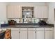 Stylish bar area with display shelving, mirrored backsplash, and ample counter space at 3476 Tarpon Woods Blvd, Palm Harbor, FL 34685