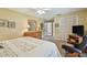 Bedroom featuring a ceiling fan, closet, and a seating area with a leather chair at 3476 Tarpon Woods Blvd, Palm Harbor, FL 34685