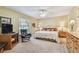 Bedroom featuring a ceiling fan, large windows, and two dressers at 3476 Tarpon Woods Blvd, Palm Harbor, FL 34685