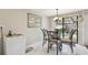 Dining area with a glass table and sliding glass doors to the outdoor patio at 3476 Tarpon Woods Blvd, Palm Harbor, FL 34685