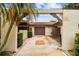 Home featuring an arched entryway, two-car garage, and patterned driveway at 3476 Tarpon Woods Blvd, Palm Harbor, FL 34685