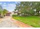 Charming single-story home featuring a tile roof and an attached garage at 3476 Tarpon Woods Blvd, Palm Harbor, FL 34685