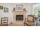 Elegant fireplace with decorative tile surround and mantel, enhanced by pelican-themed decor at 3476 Tarpon Woods Blvd, Palm Harbor, FL 34685