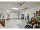 Bright garage featuring a garage door, ample storage space and concrete flooring at 3476 Tarpon Woods Blvd, Palm Harbor, FL 34685