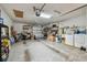 Spacious garage featuring a garage door, shelving, laundry machines and ample storage space at 3476 Tarpon Woods Blvd, Palm Harbor, FL 34685