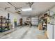 Spacious garage with overhead storage, shelves, and a washer and dryer at 3476 Tarpon Woods Blvd, Palm Harbor, FL 34685