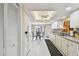 Bright, updated kitchen featuring white cabinets and tile flooring at 3476 Tarpon Woods Blvd, Palm Harbor, FL 34685