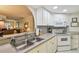 Functional kitchen featuring white appliances, a stainless steel sink, and an open layout at 3476 Tarpon Woods Blvd, Palm Harbor, FL 34685