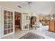 Inviting living area with tile floors, access to the patio, and seamless flow to other rooms at 3476 Tarpon Woods Blvd, Palm Harbor, FL 34685