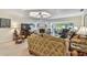 Comfortable living room with lots of space, natural light, and an electric fireplace at 3476 Tarpon Woods Blvd, Palm Harbor, FL 34685
