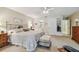 Comfortable main bedroom with carpeted floors, a ceiling fan, and ample closet space at 3476 Tarpon Woods Blvd, Palm Harbor, FL 34685