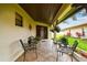 Relaxing outdoor patio with seating and well-maintained landscaping around the perimeter at 3476 Tarpon Woods Blvd, Palm Harbor, FL 34685