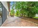 Inviting brick paver patio perfect for outdoor dining and relaxation, surrounded by lush landscaping at 3476 Tarpon Woods Blvd, Palm Harbor, FL 34685