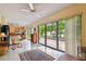 Bright sun room with tile flooring, large sliding doors to the yard, and a ceiling fan at 3476 Tarpon Woods Blvd, Palm Harbor, FL 34685