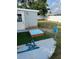 Backyard area featuring a small sandbox, a dismantled swing, and a shed at 3612 Devonshire Dr, Holiday, FL 34691