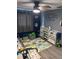 bedroom featuring a bed, toys, and playmat on wood-look flooring at 3612 Devonshire Dr, Holiday, FL 34691