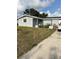 Charming single story home with a neatly kept yard and sunny skies above at 3612 Devonshire Dr, Holiday, FL 34691