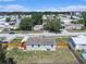 Aerial view showcasing the home's backyard, wooden deck, and the surrounding neighborhood at 3924 Kiah Dr, Wesley Chapel, FL 33543